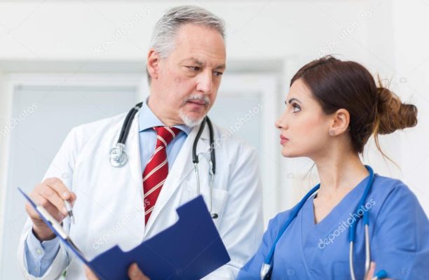 depositphotos_136993830-stock-photo-doctor-talking-to-a-nurse